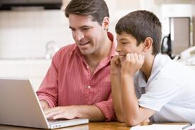 parent and child on computer